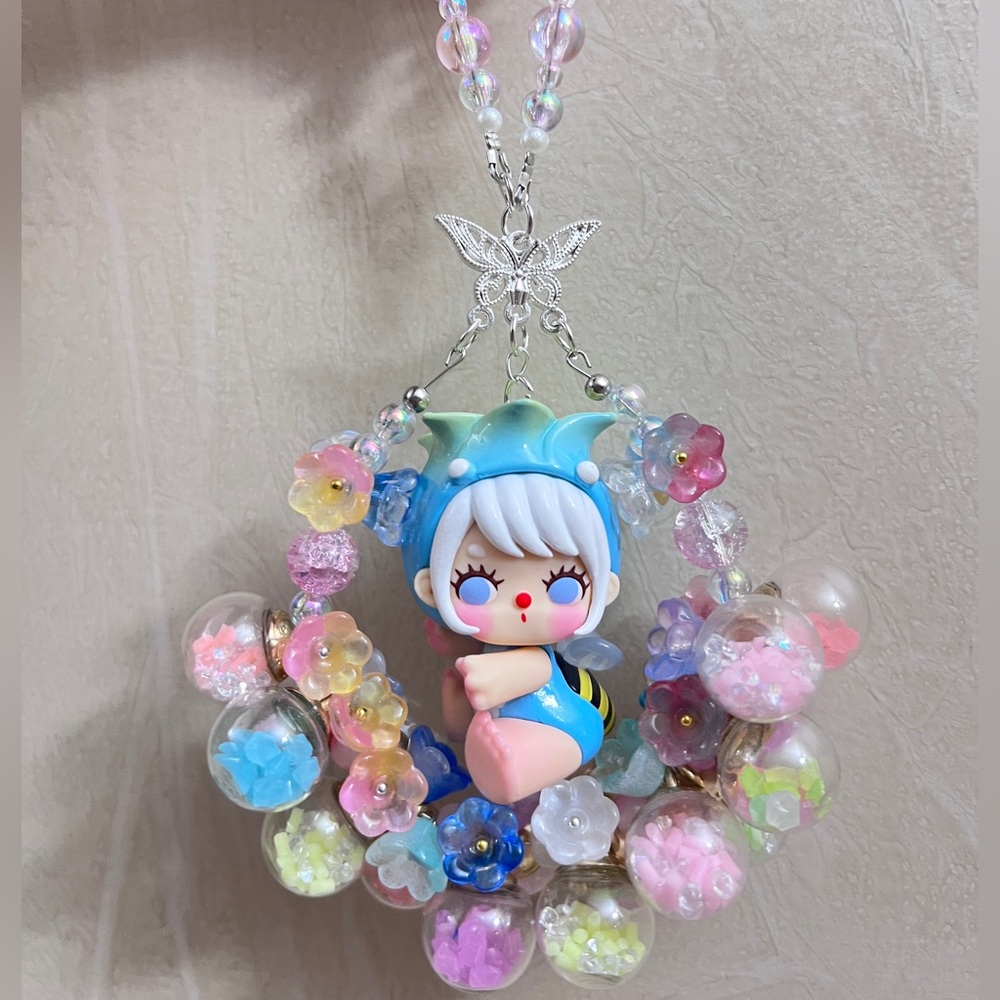 🎁Luminous flower ball with Cute Doll Pendant